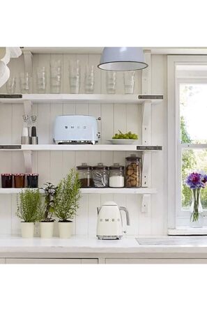 Тостер Smeg TSF02PBEU - 2 слоти для 4 тости, 6 рівнів підсмажування, функція підігріву, розморожування та приготування багелів, знімний піддон, 1500W, пастельно-блакитний