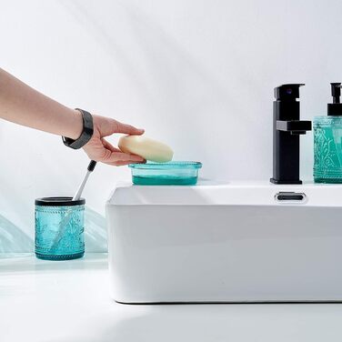 4-piece glass bathroom accessory set with decorative pressed pattern, including soap dispenser, tumbler, soap dish, and toothbrush holder, blue-green
