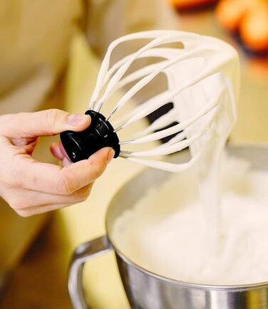 Stand mixer with bowl for cakes and bread with baking accessories. Various models also include a meat grinder and blender. 16746