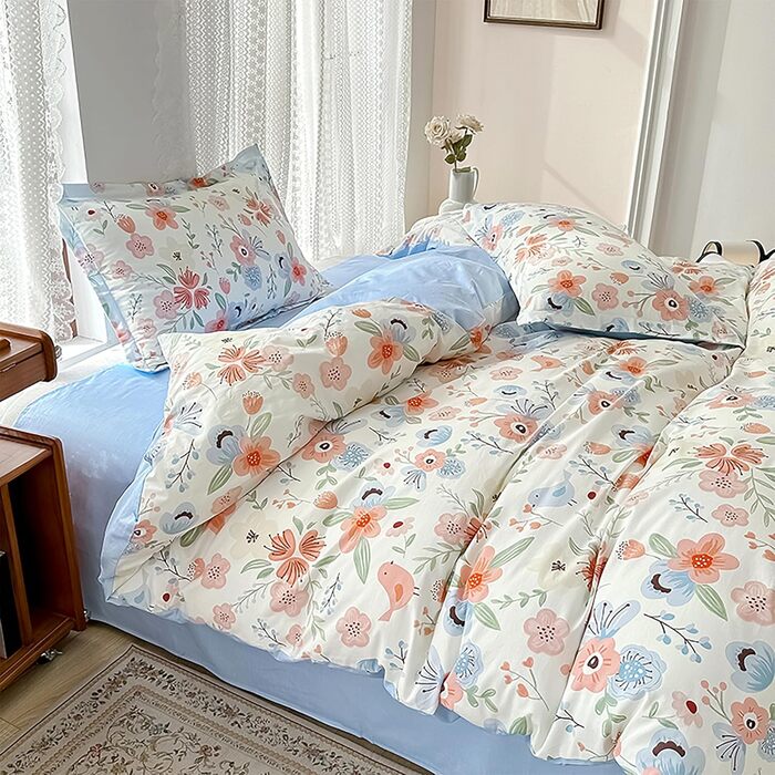 Блискуча постільна білизна Bunt Blumen з бавовни 100x135 см. Комплект для дитячого ліжка: простирадло, ковдра та подушка з квітковим малюнком.