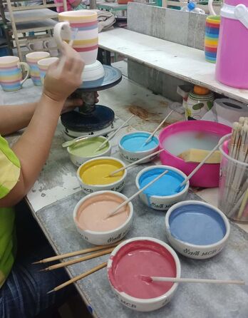 Hand-painted sugar bowl and teapot set with rainbow stripes