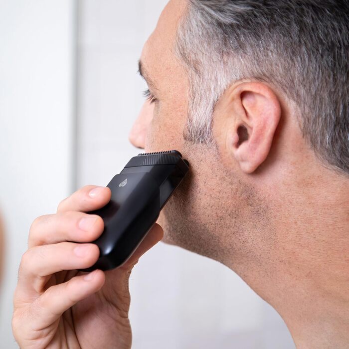 The Handyman™ by MANSCAPED®: Travel Shaver, Lightweight Rechargeable Electric Shaver with USB-C Charging Cable for On-the-Go, Washable, with Long Hair Trimmer and Foil Shaver Head.