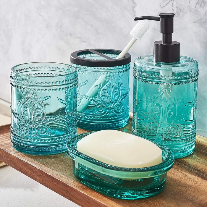 4-piece glass bathroom accessory set with decorative pressed pattern, including soap dispenser, tumbler, soap dish, and toothbrush holder, blue-green