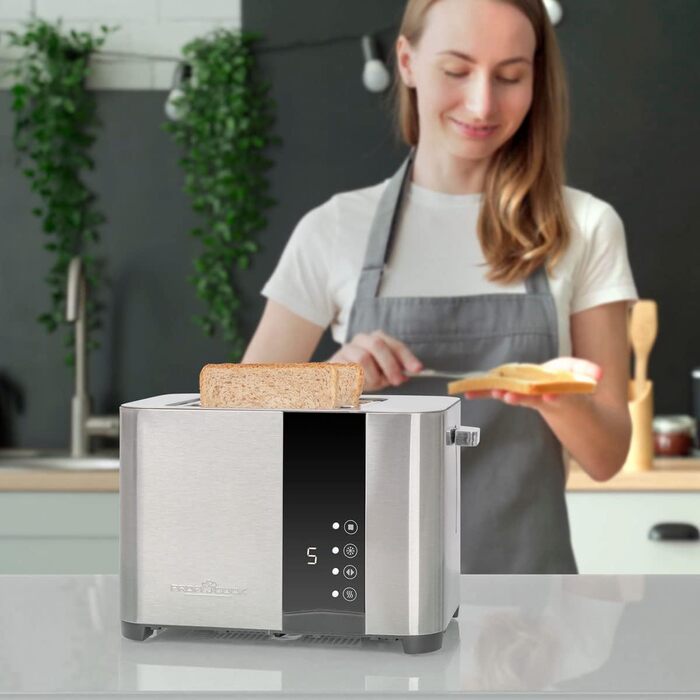 Тостер ProfiCook PC-TA 1250 Inox з сенсорним дисплеєм: 2 слоти, нержавіюча сталь, 850 Вт, 7 рівнів підсмажування, підставка для тостів, висувна кришка для крихт, згортання кабелю