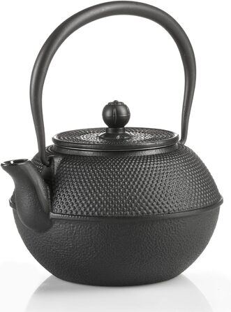 Asian cast iron teapot. Traditional iron teapot.